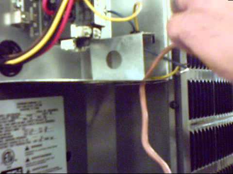 Installing low voltage wire on an air conditioner
